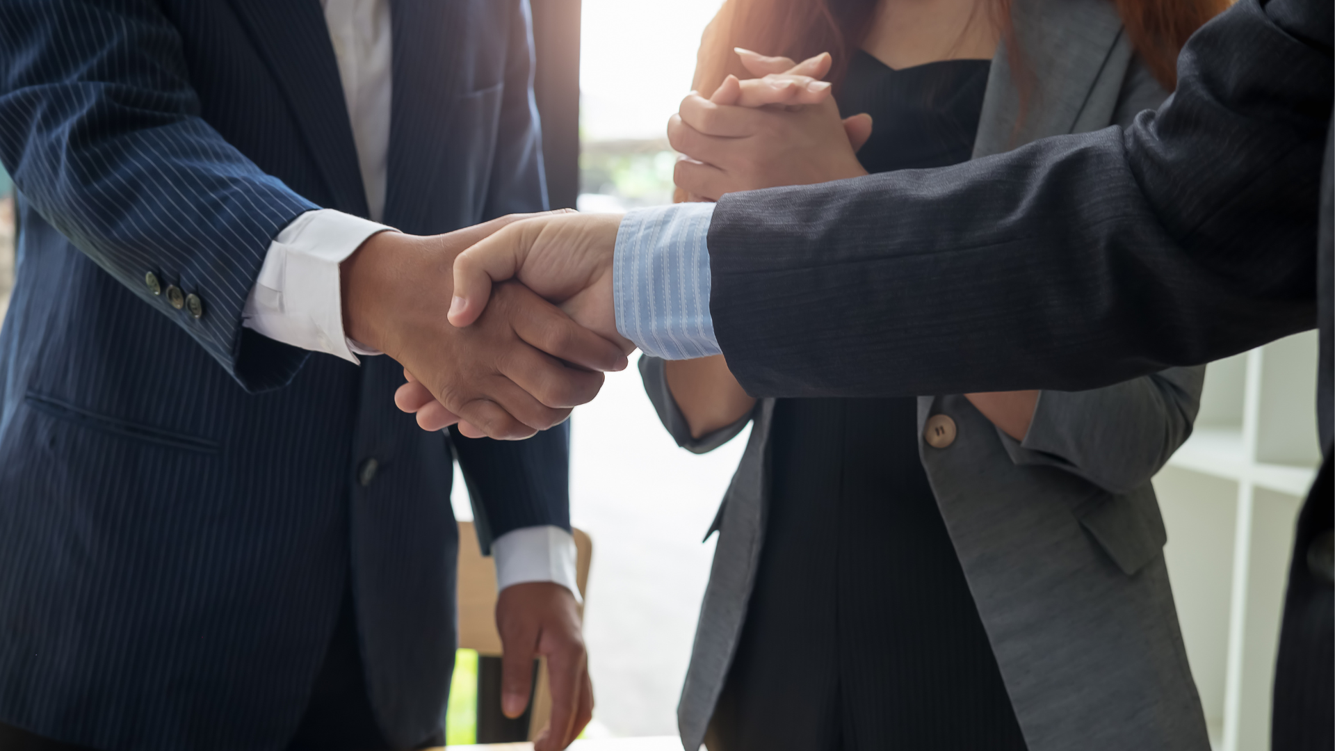 shaking hands with your new software development partner